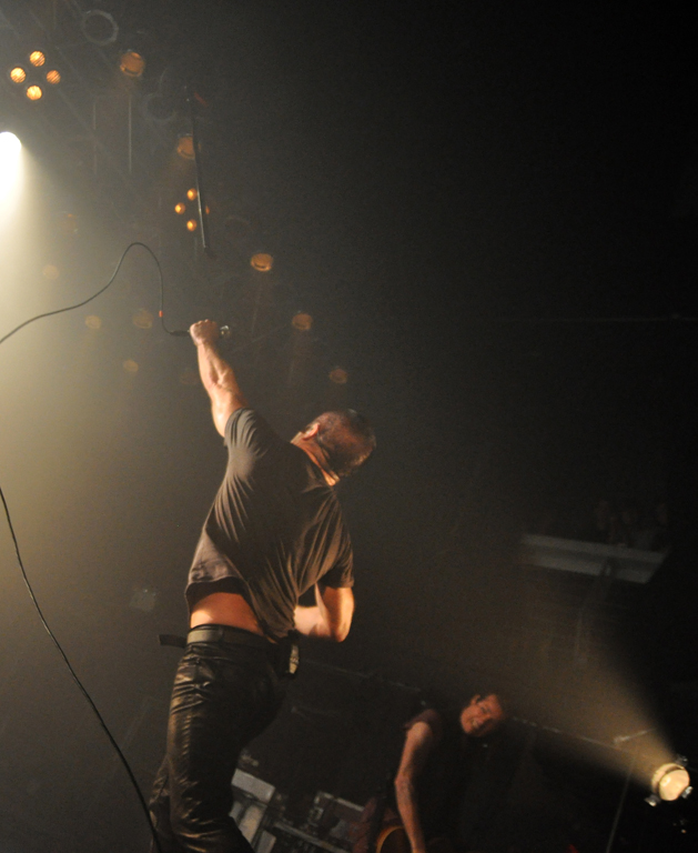 Trent Reznor hurls the mic stand / credit: Loren Wohl